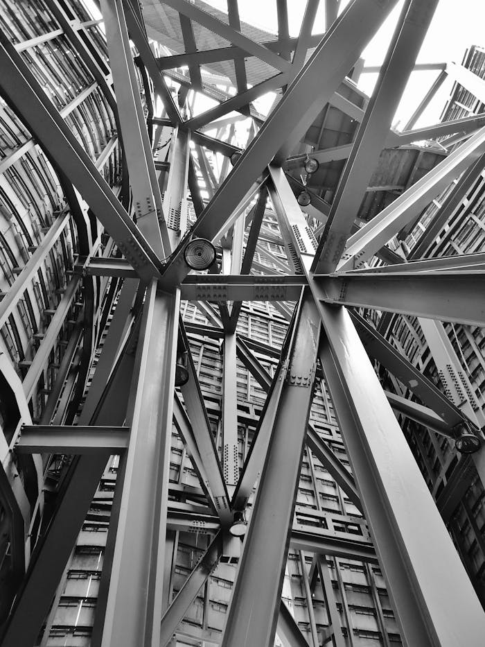 services-03 A detailed view of a complex steel framework showcasing modern industrial architecture.