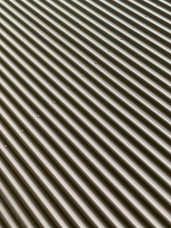 Detailed view of a corrugated metal sheet showcasing texture and pattern.
